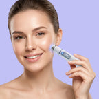 Smiling woman holding the blue light facial pen