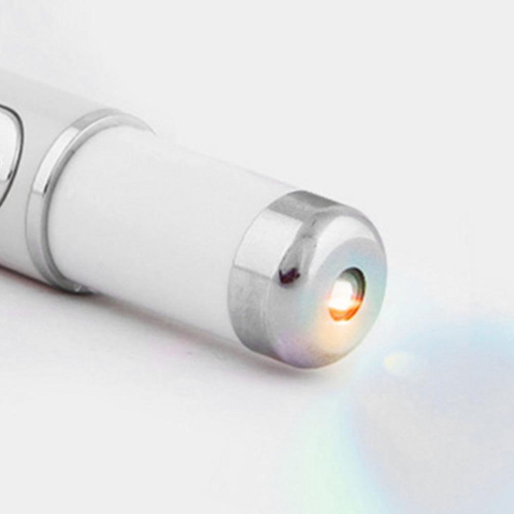 Close-up of the silver tip of the blue light pen
